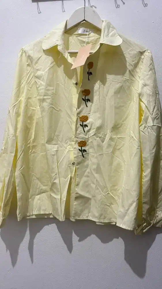 Kemeja motif bunga