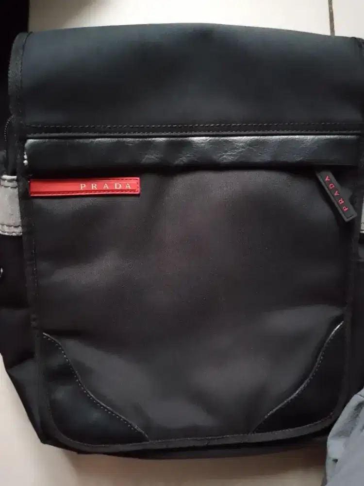 Tas slempang laki dan wanita