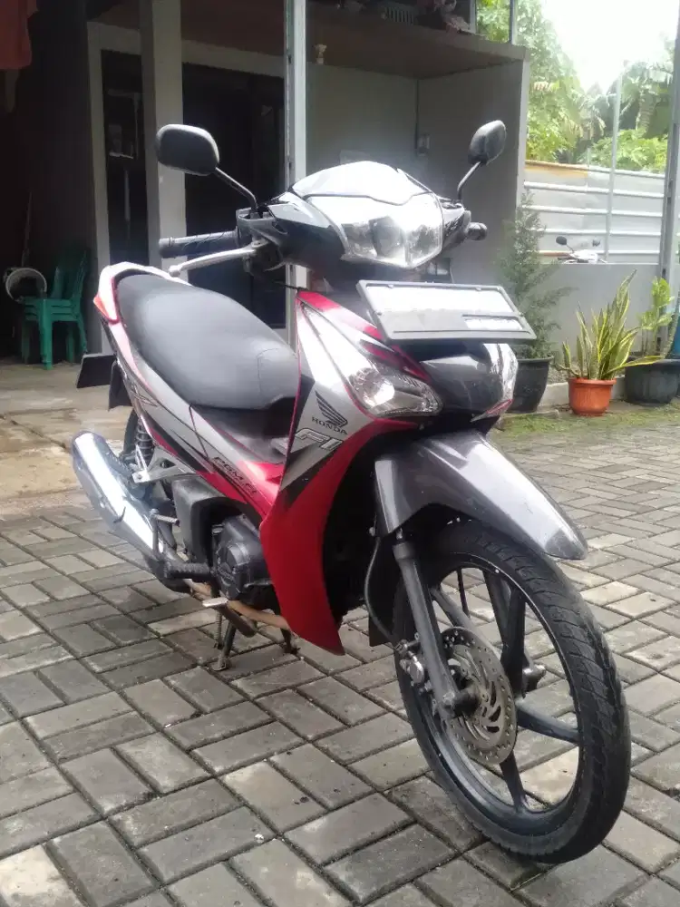 Honda Supra X helm in FI tahun 2012