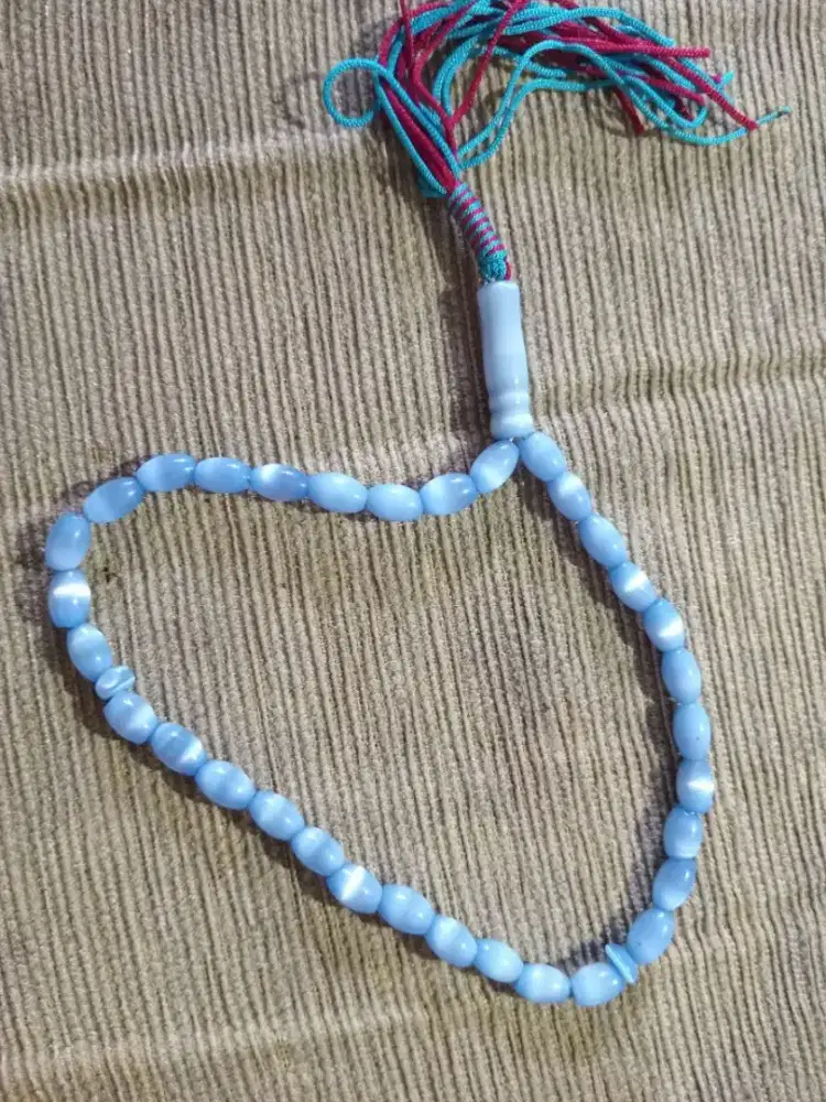 Koleksi tasbih batu mata kucing hijau biru.
