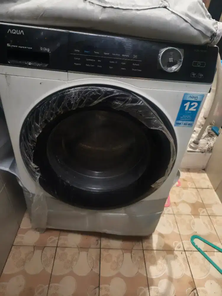 Mesin cuci otomatis front loading tutup samping / depan 9kg AQUA