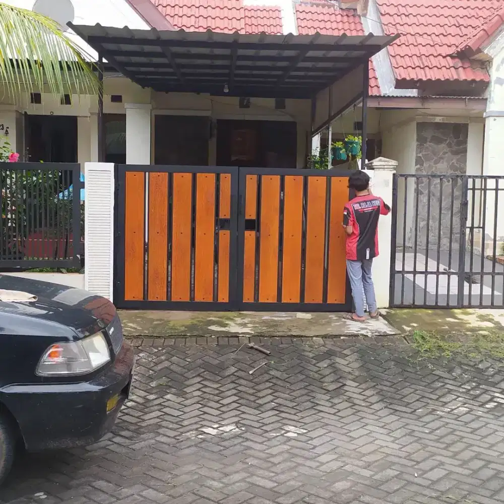 Pagar Garasi Tipe GRC Surat kayu