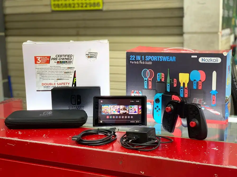 Nintendo Switch V1 256GB + Acc Sportswear