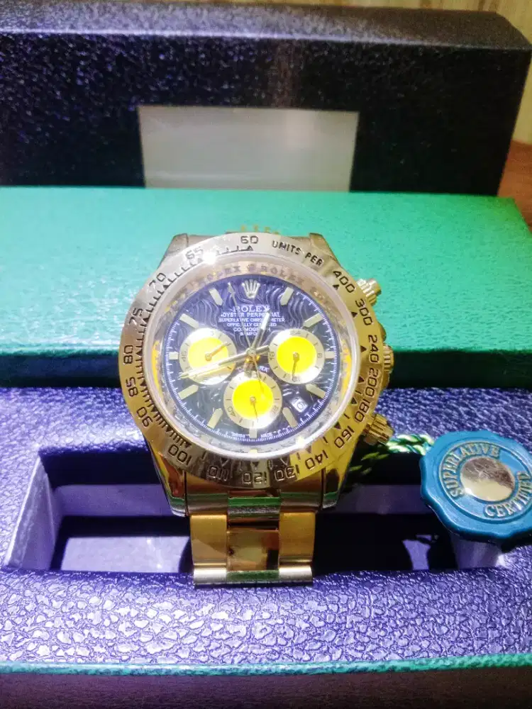Rolex daytona bamford oiyester gold case