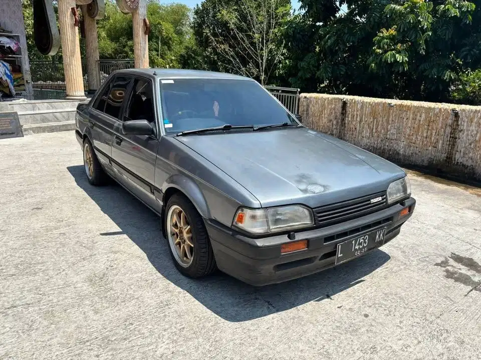 1988 Mazda 323 Elite Plat L winda mobil bekas sekoto kediri