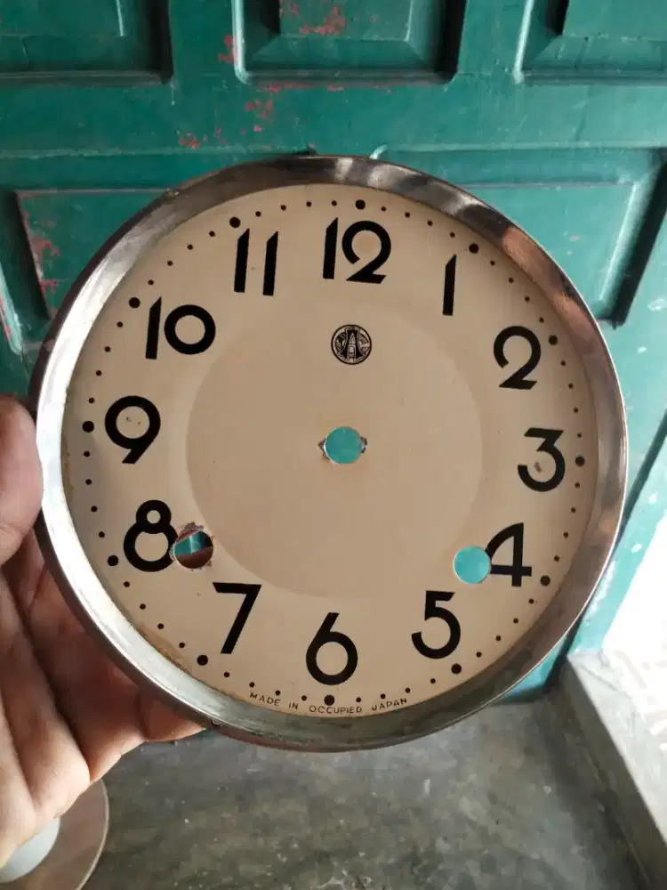 Plat dial jam lubang 2