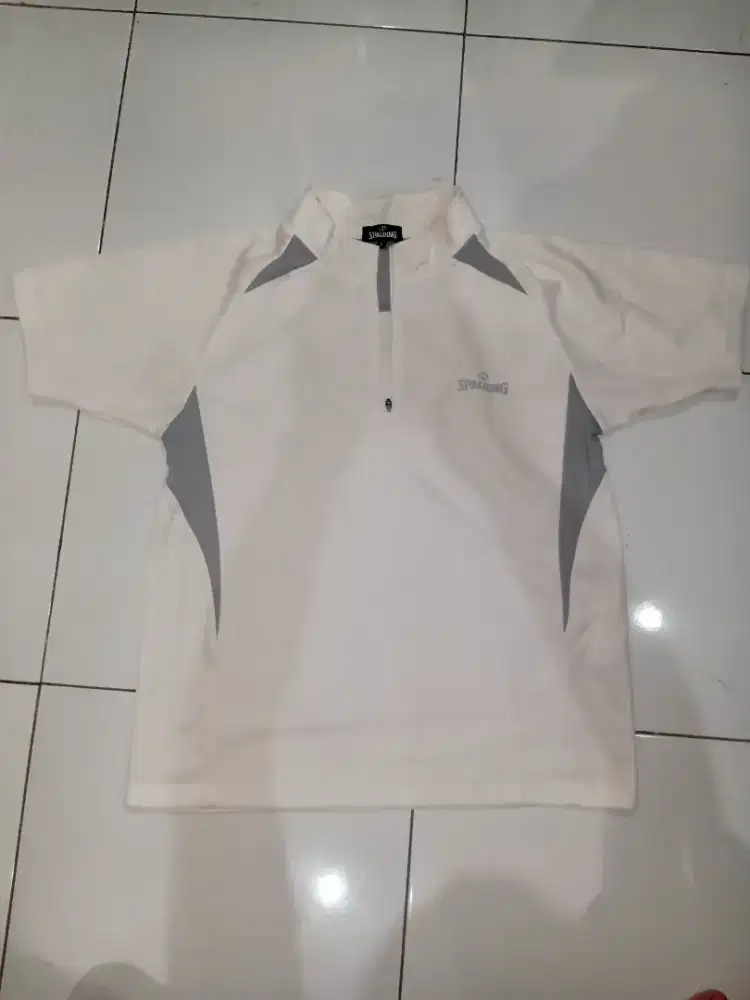 Baju olahraga spelding