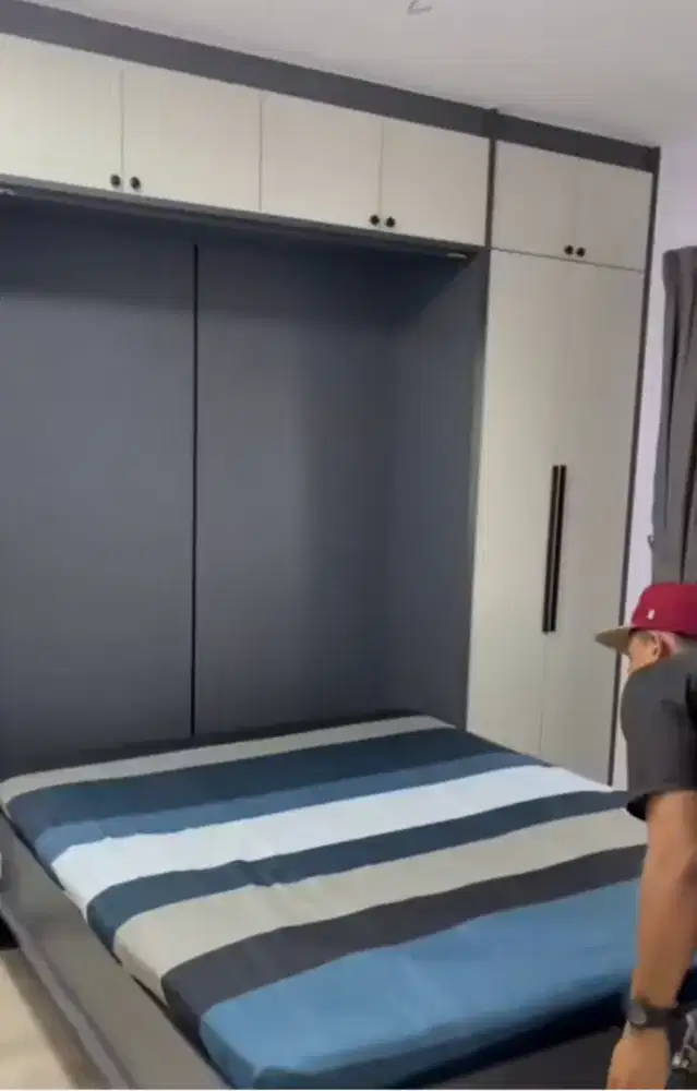 Ranjang lipat dinding multifungsi (wall bed)