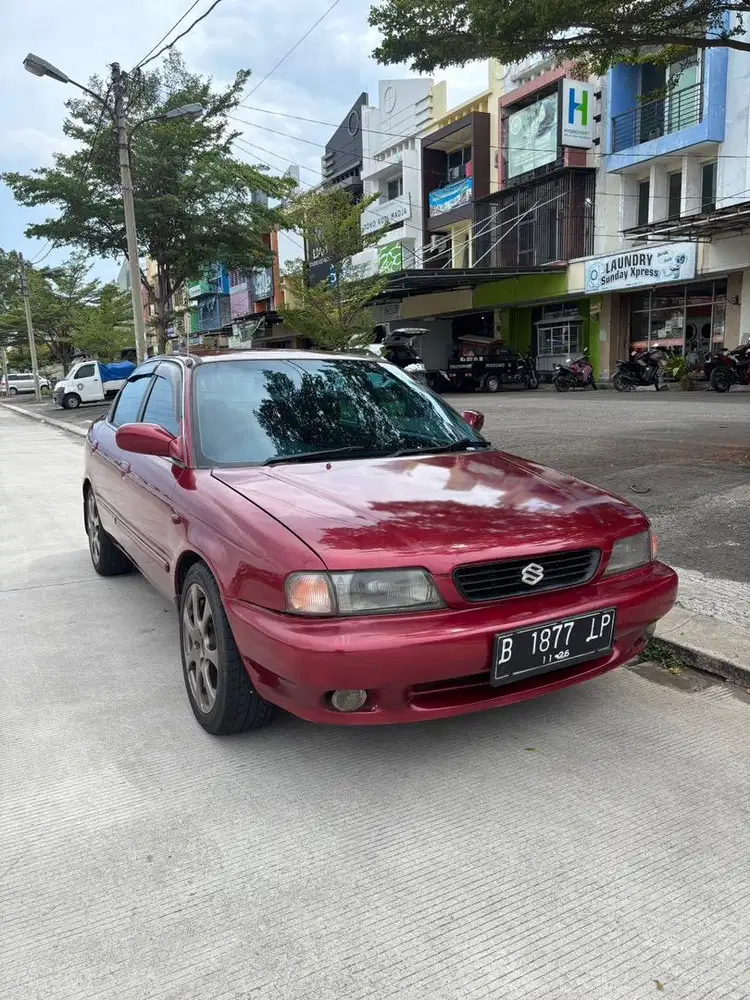 Suzuki Baleno DX 96 Gen 1 M/T Merah Metalik