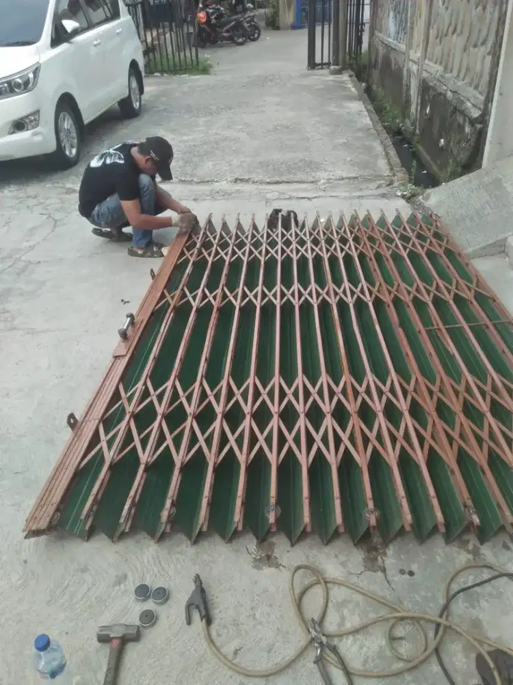 Reparasi perbaikan rolling door folding gate murah