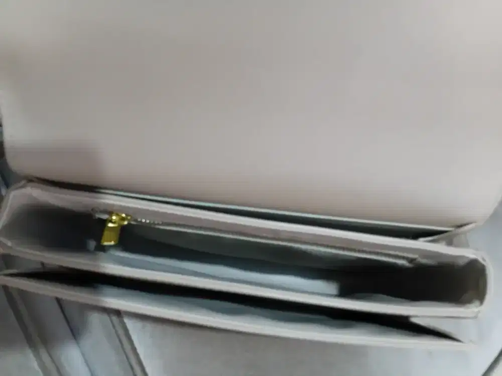 Tas second im/elegant