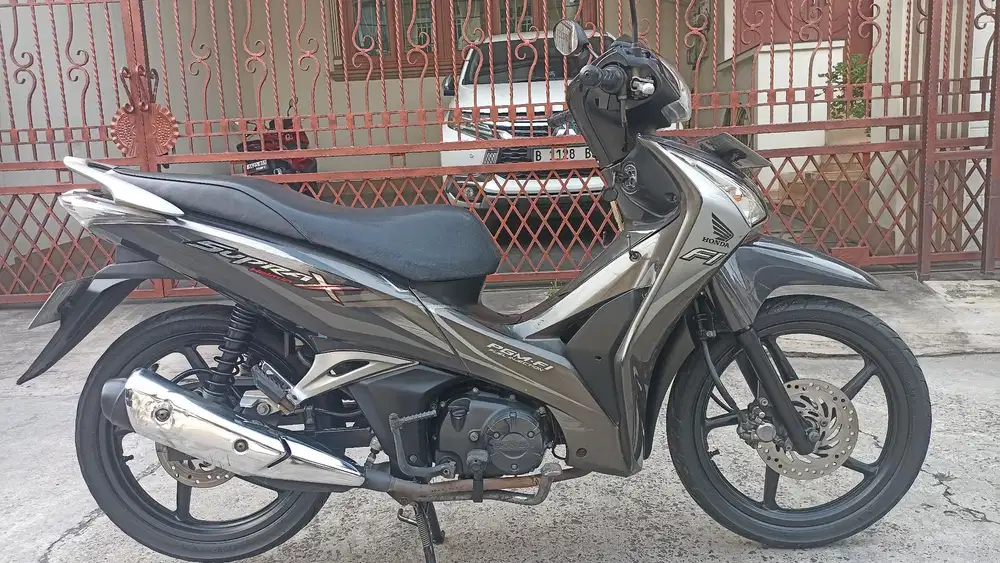 Honda Supra X 125 F1 helm in tahun 2014.