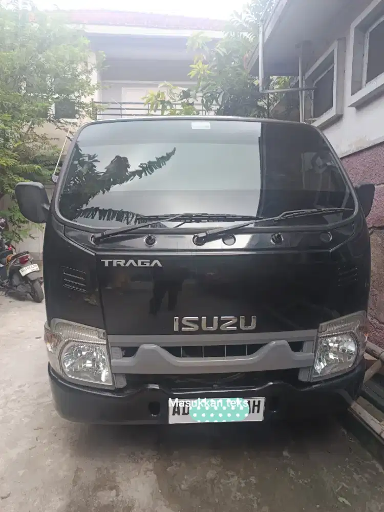Isuzu Traga Pick Up Hitam tahun 2024