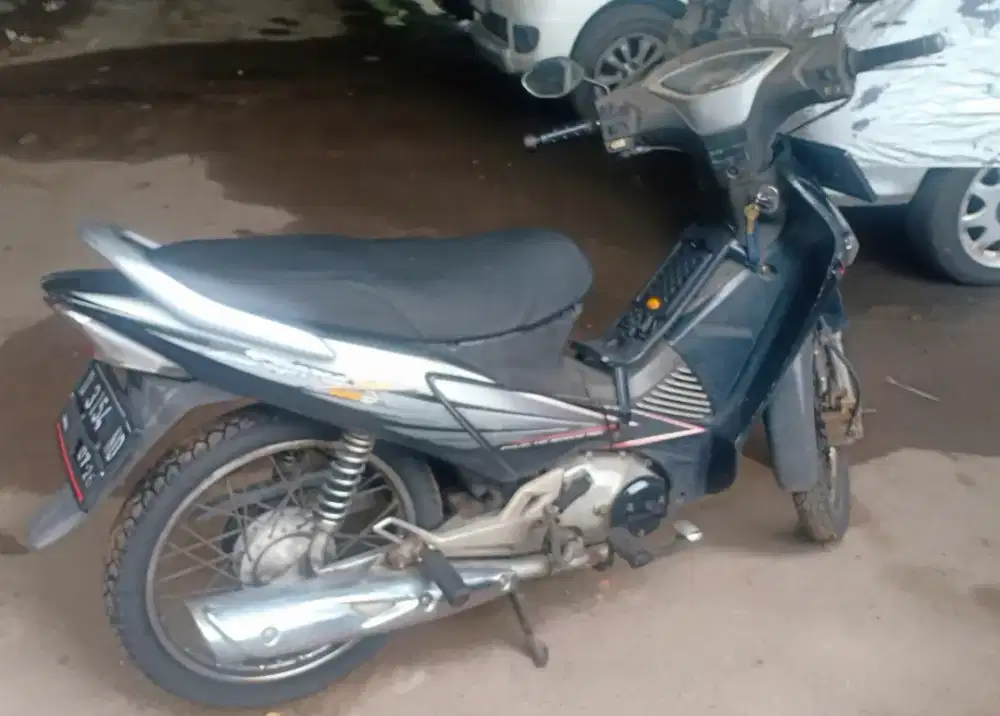 Supra x 125 satu tangan