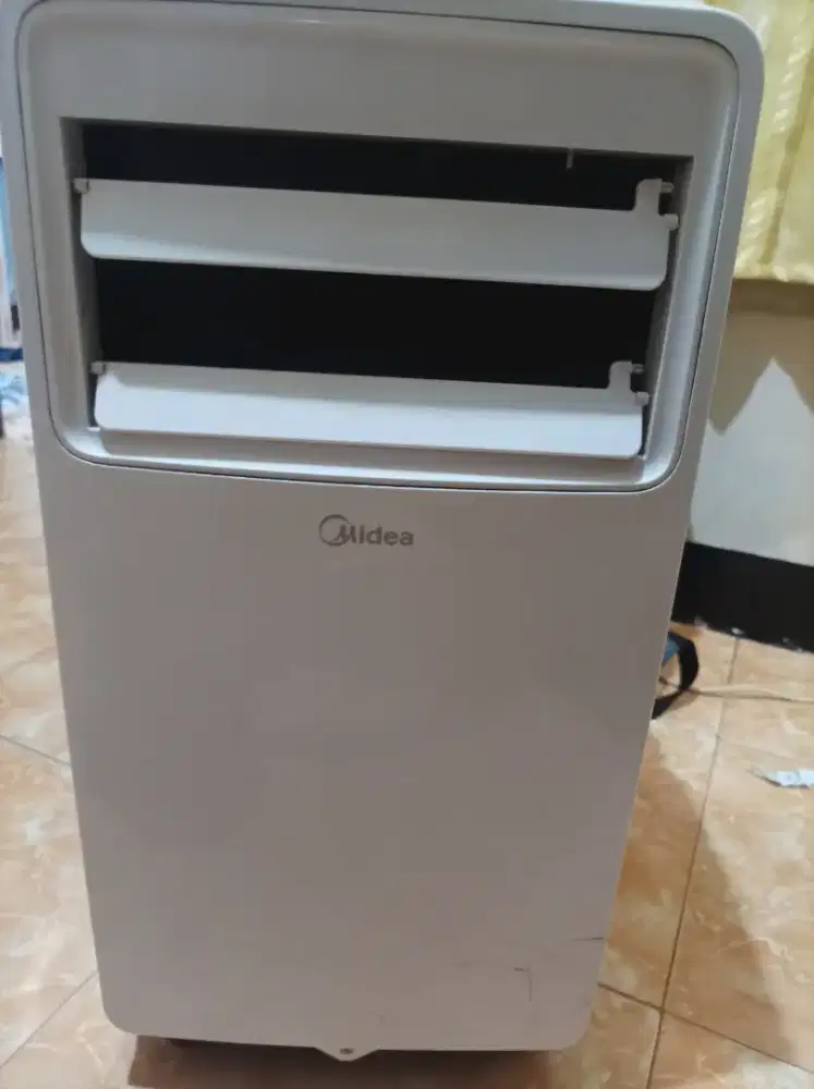 AC portable midea 1/2 pk