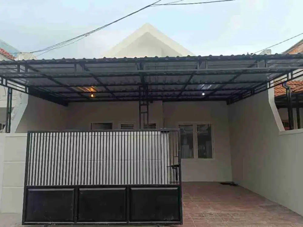 Rumah minimalis sudah renov berpagar di Nirwana Eksekutif dekat Merr