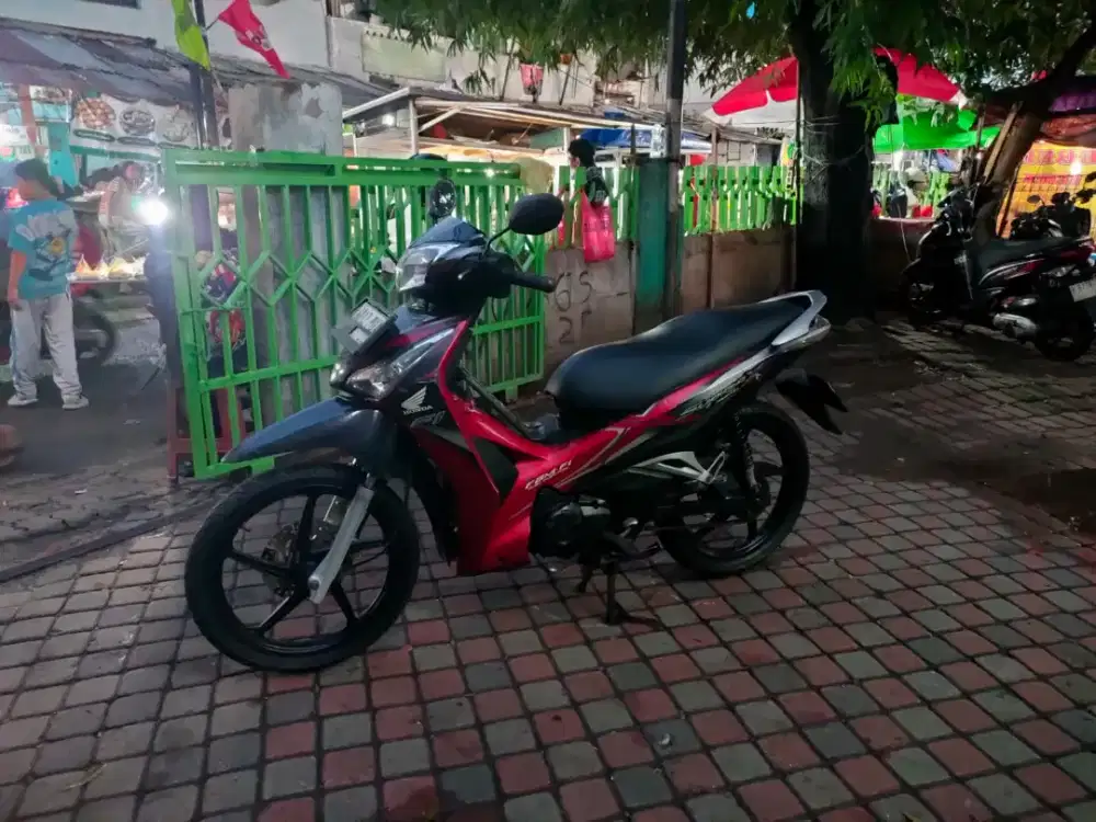 Honda Supra X Helm In 125cc PGM-FI Tahun 2012