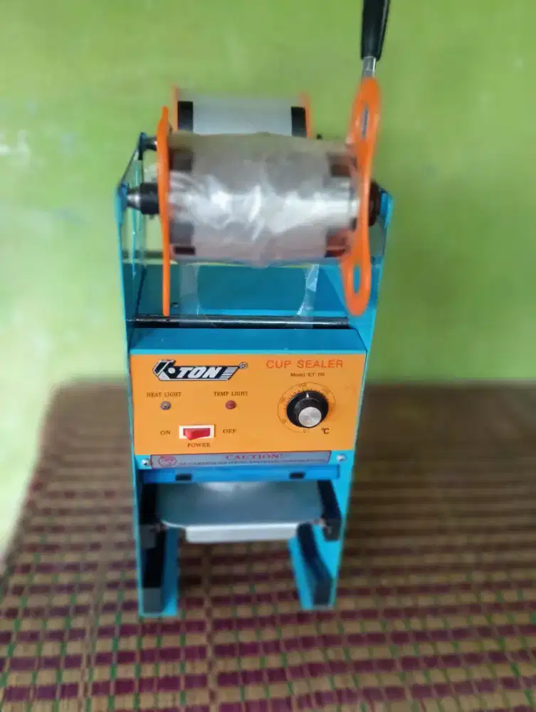 Cup Sealer  press