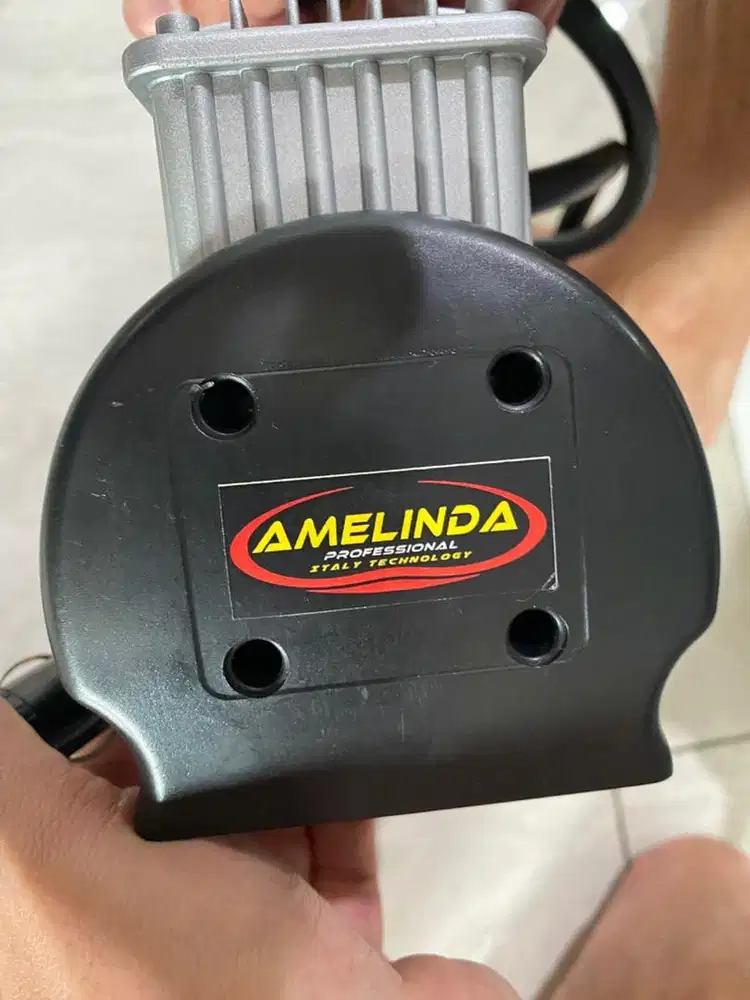 Amelinda compesor listrik