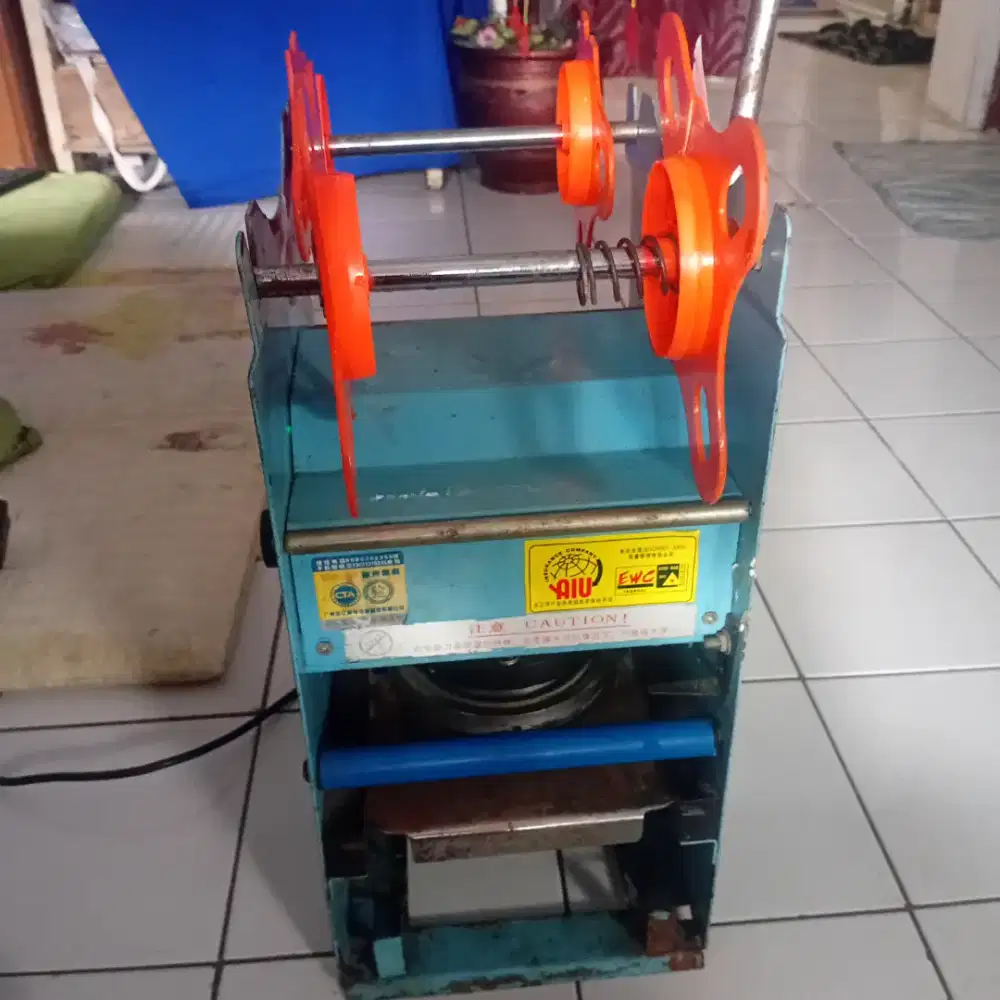 Mesin Pres minuman Teh, es jeruk dll