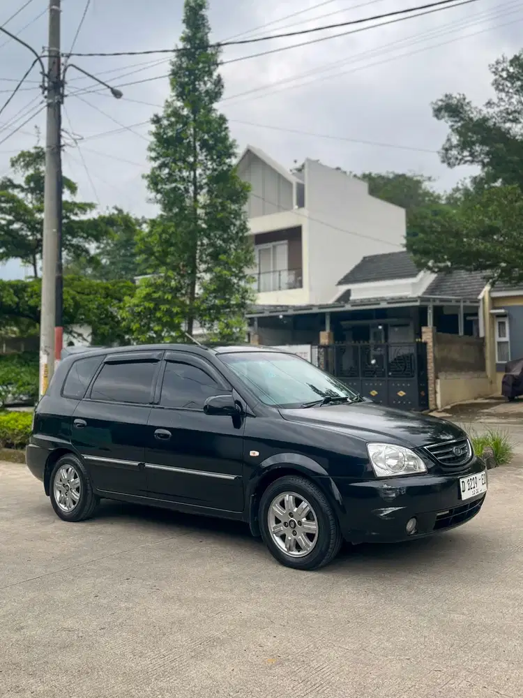 Kia Carens II bensin android kamera mundur pjk pjg Interior rapih