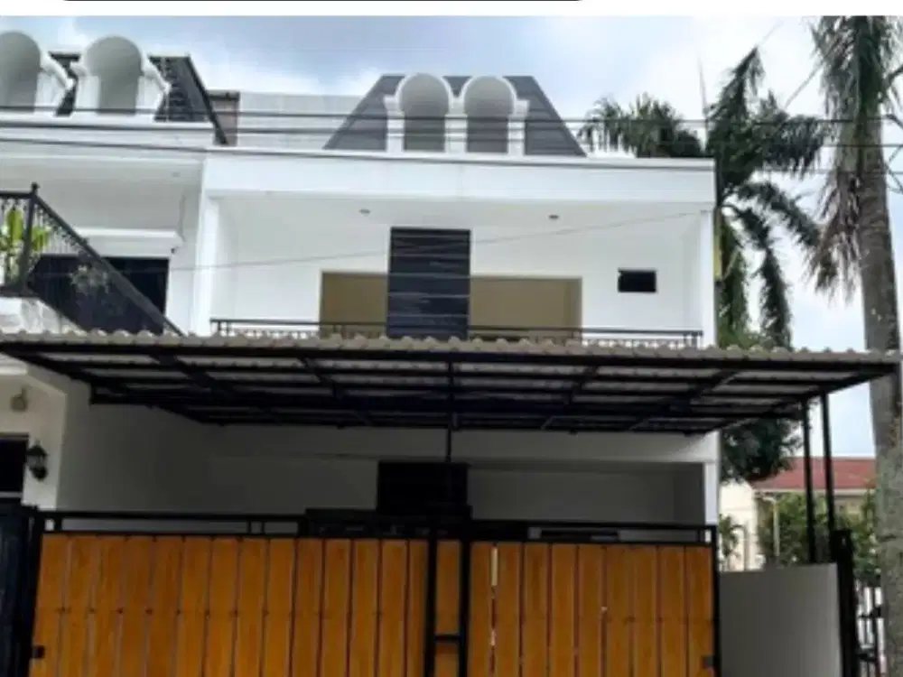 RUMAH HOOK GAYA AMERICAN MODERN DI LOKASI SUPER STRATEGIS