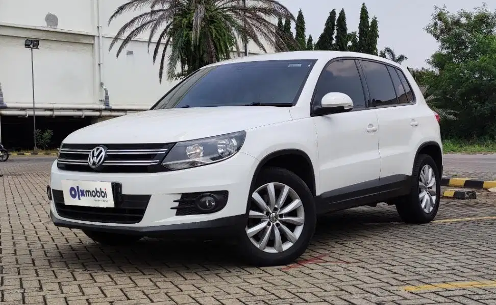 TDP 6,JT Volkswagen Tiguan 1.4 Bensin-AT Coklat 2014