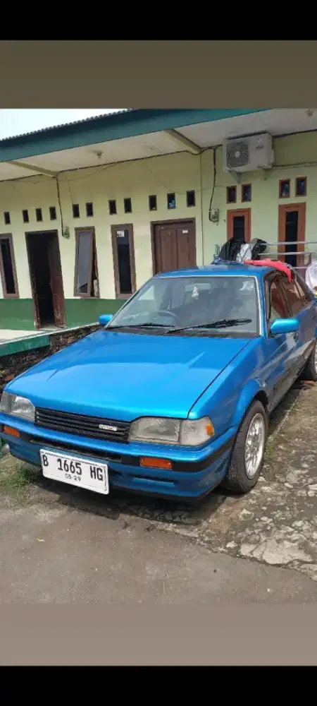 Mazda 323 1988 biru metalik