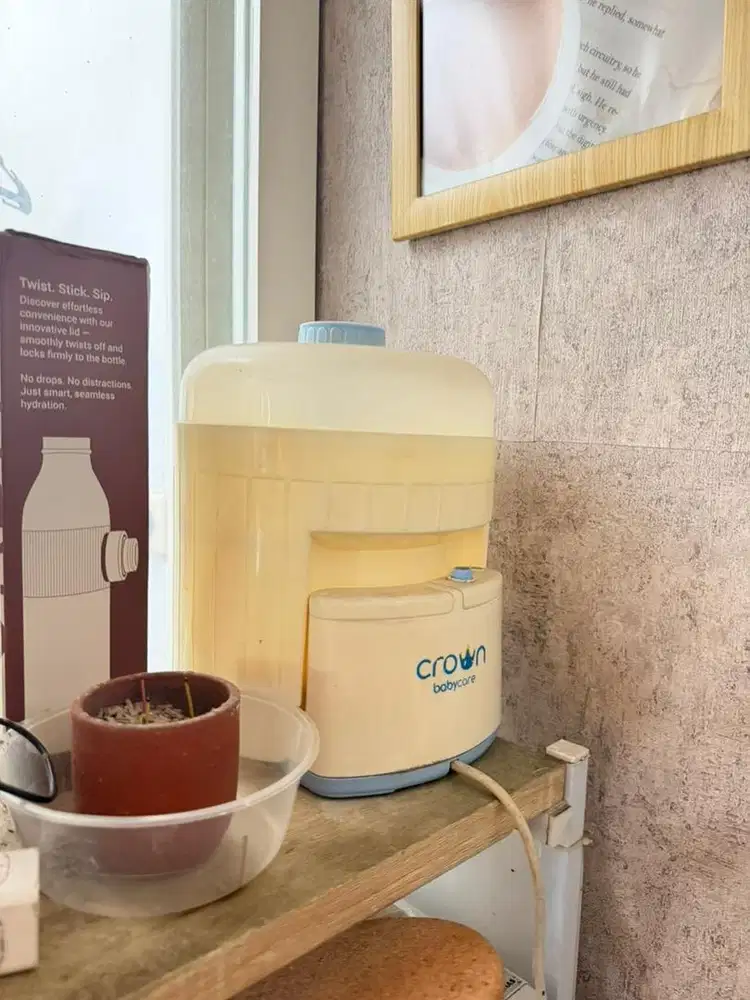 Sterilizer botol bayi merk baby crown
