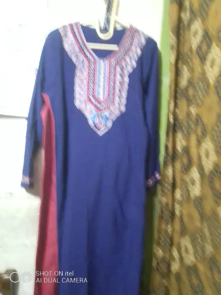 Baju muslim masih baru
