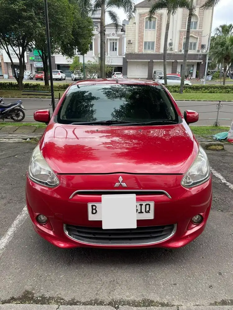 Mitsubishi mirage exceed merah 2014