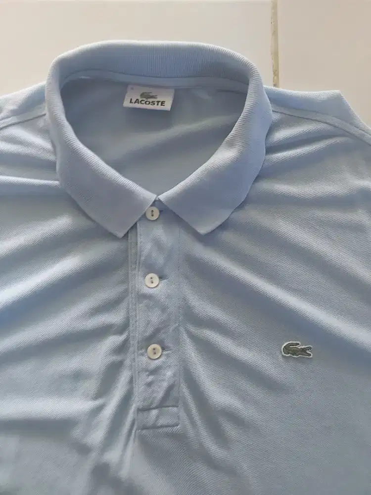 LACOSTE Warna Biru Langit,Warna Pekat,Mulus,No defect.Lebr Dd 55cm,XL.