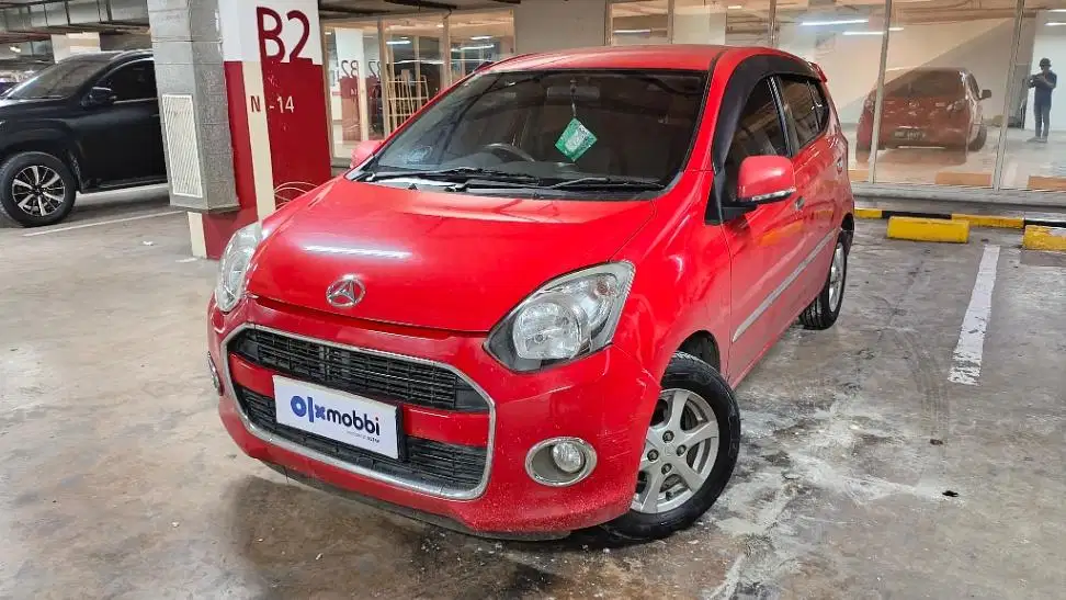 DP MURAH Daihatsu Ayla 1.0 M Bensin-AT 2015 Merah CADBD