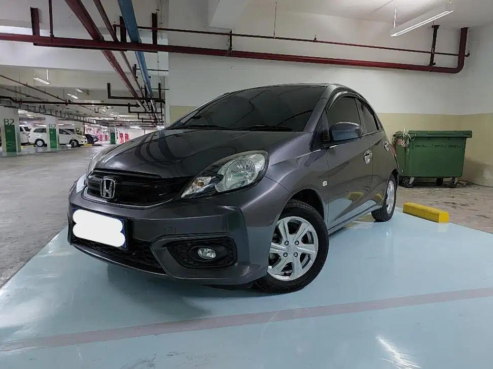 DP MURAH Honda Brio Satya 1.2 E Bensin-AT 2017 Abu CAFJD