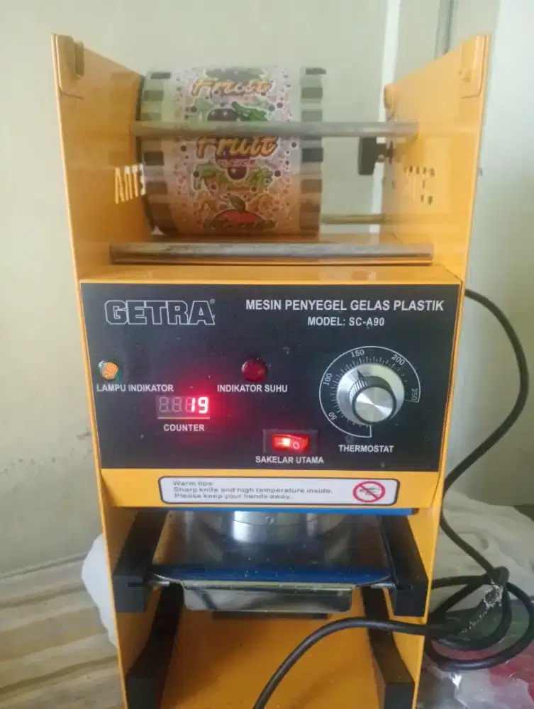 mesin penyegel gelas plastik