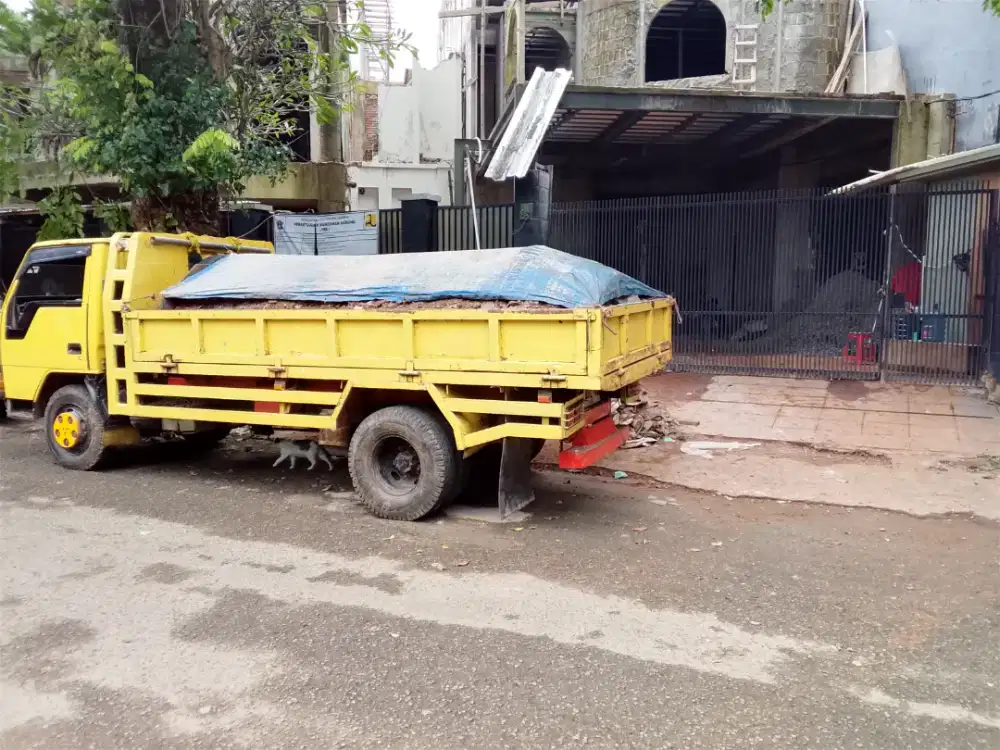 Tukang buang puing sampah dll