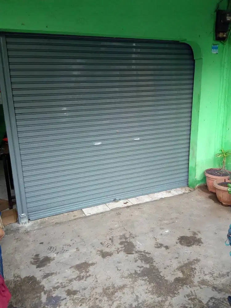 spesialis service rolling door murah