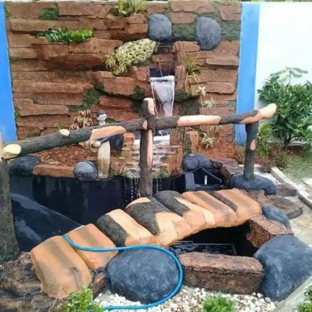 Pembuatan kolam tropis relief tebing