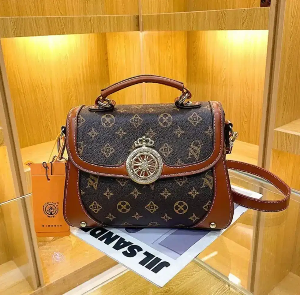 Sling bag top handle