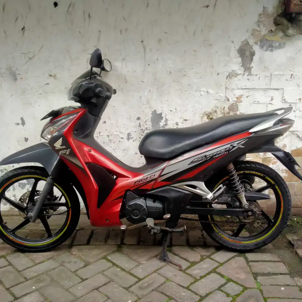 Supra X125 CC Helm in thn 2012 Injection