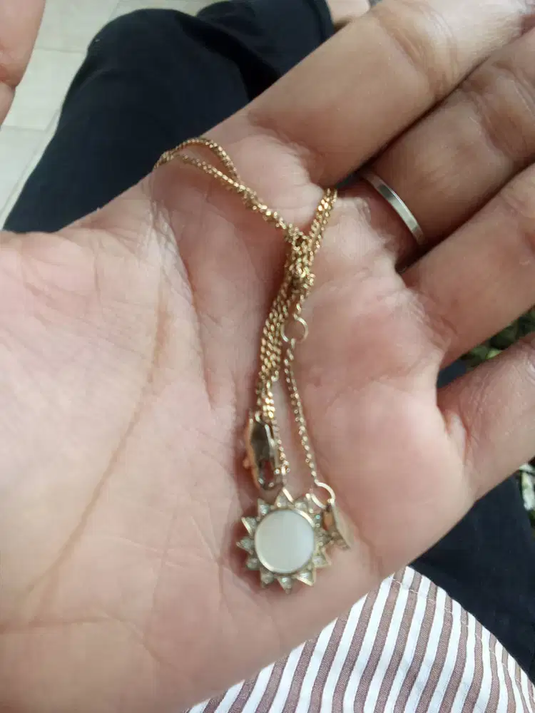 merk fossil,kalung matahari liontin