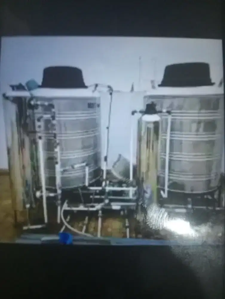 Pasang tabung filter ganti media cuci Tandon air