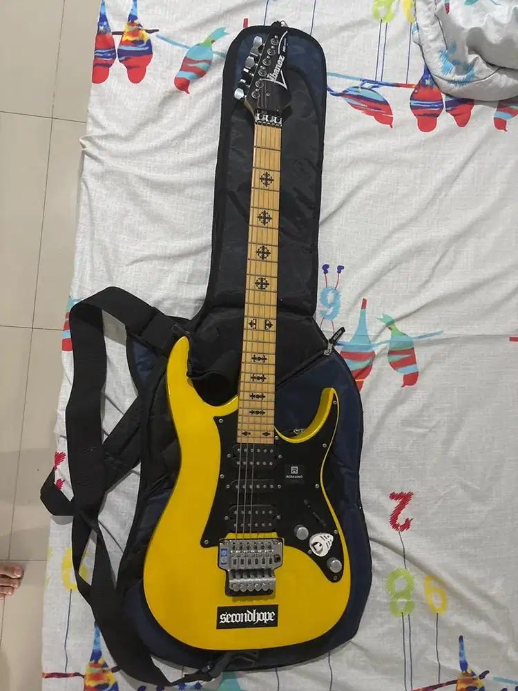 Yellow Ibanez RG series electric guitar