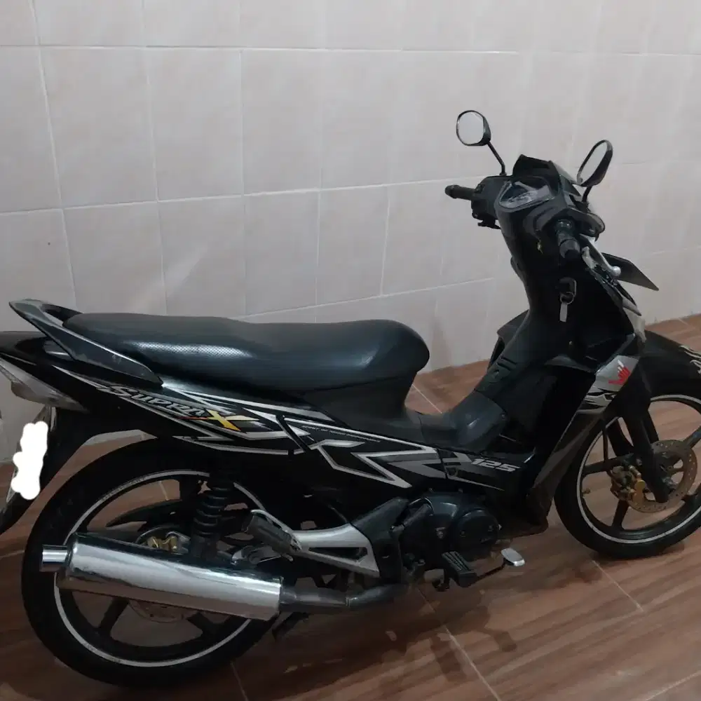 Supra X 125 2013 Karbuartor