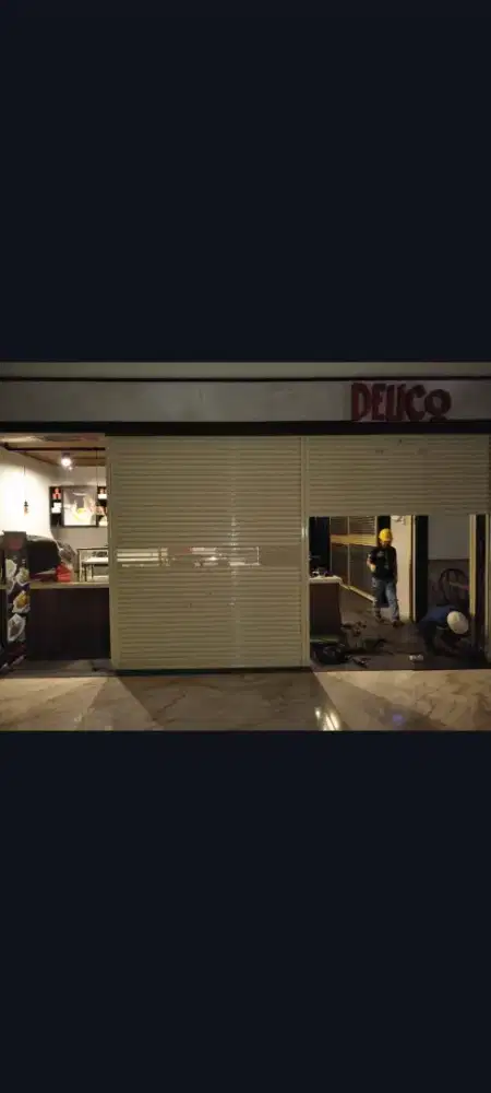 Tukang service rolling door