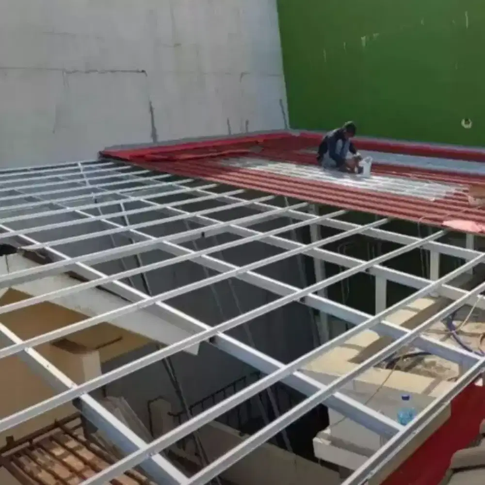 Pasang baja ringan atap spandek pasir