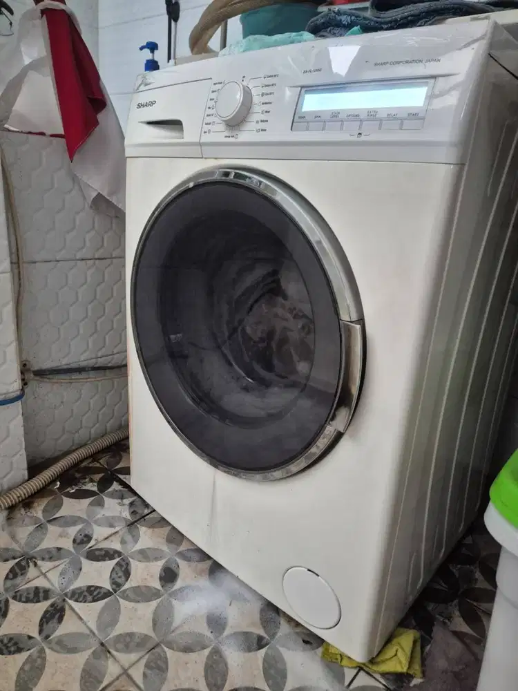 Mesin cuci Sharp front loading rusak bocor