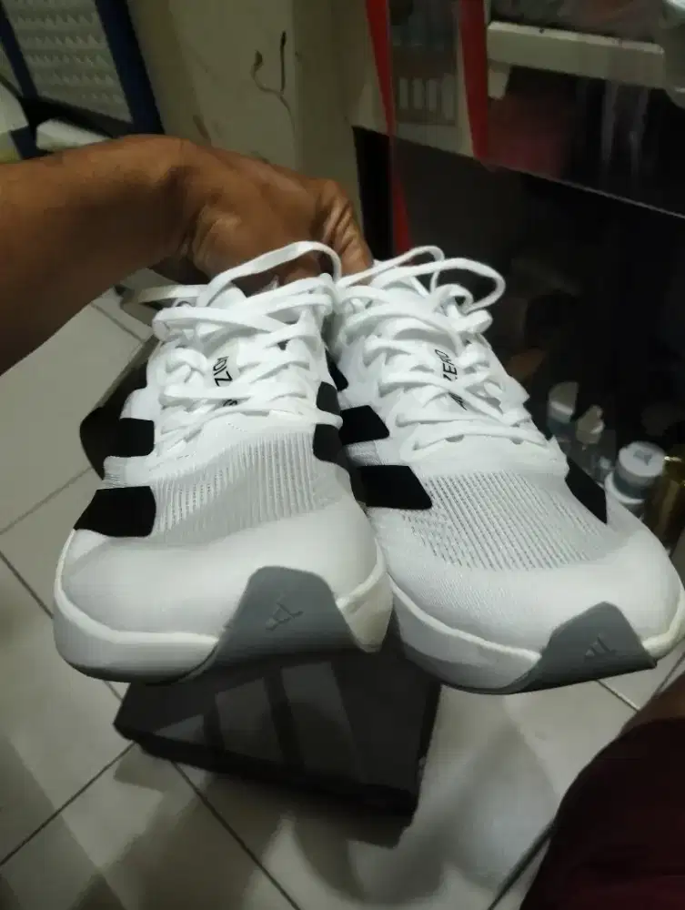 Adizero Evo sl putih list hitam