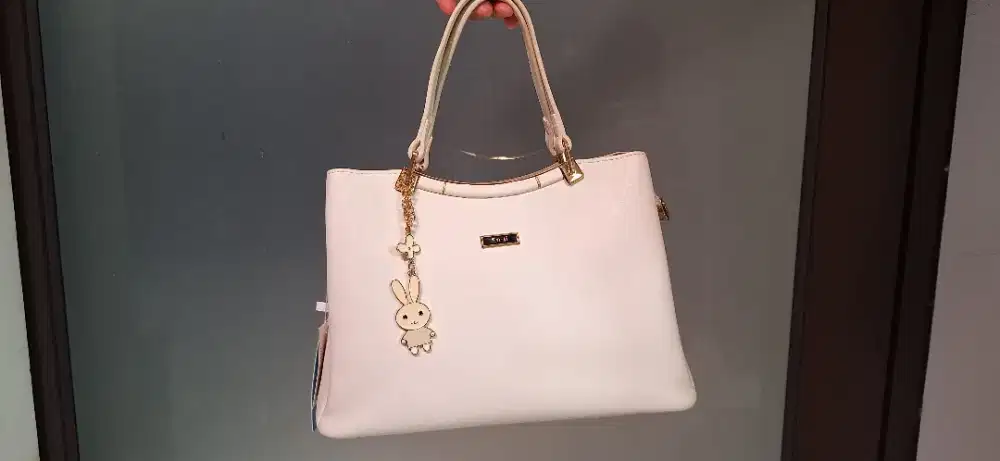 Tas en-ji warna ivory