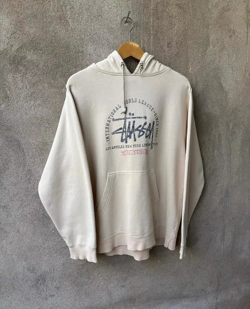 1990s vintage stussy hoodie distressed faded beige colour.